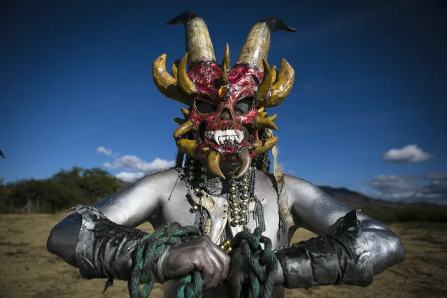 People in costumes participate during the last day of the traditional carnival of San Martin Tilcajete, in Oaxaca State, Mexico, 14 February 2018. For three days, the picturesque streets of San Martin Tilcajete are filled with colors, music, and “little devils” who roam the streets frightening and entertaining inhabitants and visitors. (Photo by Mario Arturo Martinez/EPA/EFE)