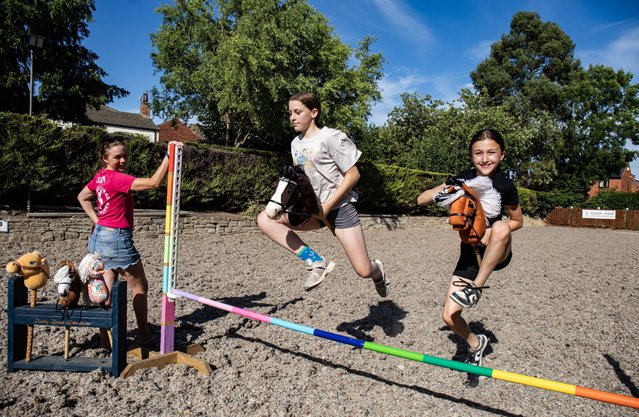 The founder of the UK’s only hobby horse club, Zoe Brown, watches on as members enjoy the activity on July 14, 2025. Brown began running competitions to help her own daughter, 11, feel less shame around her pastime. (Photo by South West News Service)