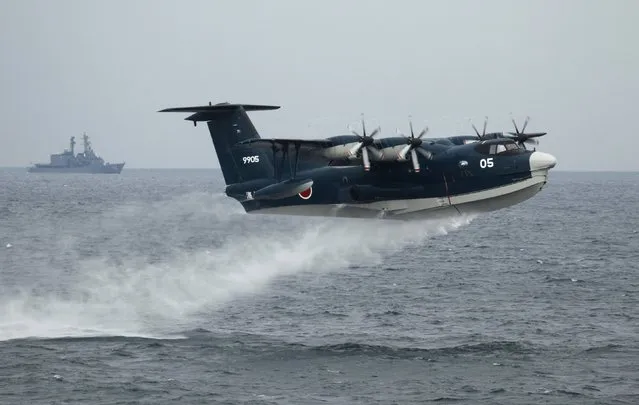 A Japanese Maritime Self-Defense Force (MSDF) seaplane takes off during a naval fleet review at Sagami Bay, off Yokosuka, south of Tokyo in this October 14, 2012 file photo. Japan is considering creating a government-backed financing arm for weapons exports, reported November 27, 2014, a move that would accelerate Prime Minister Shinzo Abe's shift away from the country's pacifist past and strengthen Tokyo's regional security ties as China's military power grows. (Photo by Yuriko Nakao/Reuters)