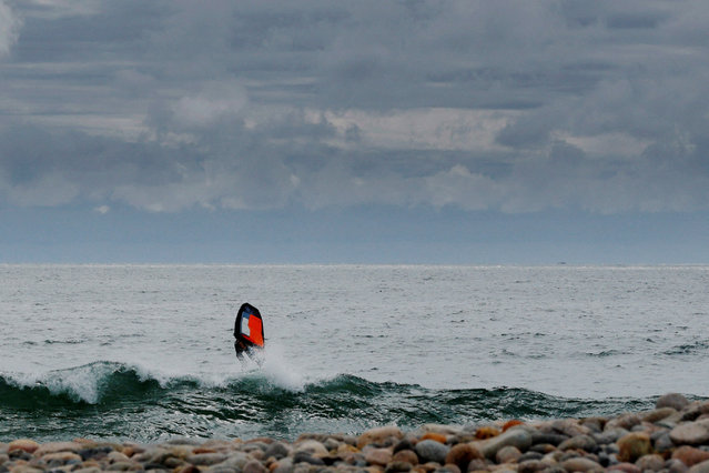 A windsurfer in Rockport, Massachusetts, on August 21, 2025. (Photo by Brian Snyder/Reuters)