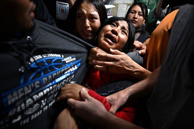 Young girls cling to their loved one, a migrant from Ecuador, as he is detained by ICE after his immigration court hearing at the Jacob Javits Federal Building in New York NY on August 26, 2025. (Photo by Carol Guzy/ZUMA Press Wire/Rex Features/Shutterstock)