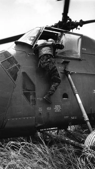 “In the cockpit of YP3 we could see the pilot slumped over the controls, Burrows recalled shortly after the mission, his words transcribed from an audio recording and published alongside his own pictures in LIFE”. (Photo by Larry Burrows/Time & Life Pictures)