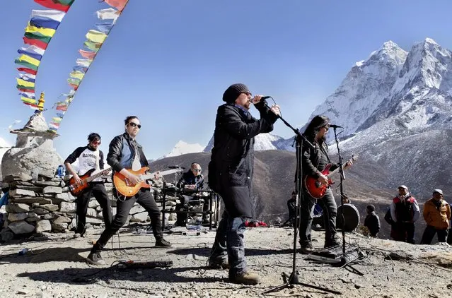 In this Sunday, November 15, 2015 photo, the Finnish rock band Ancara perform at Dingboche, a village at an altitude of 4,550 meters (14,900 feet) and a popular stop for trekkers and mountaineers heading to Everest and other peaks, Nepal. The rock band and the sign-language rapper Signmark performed in the foothills of Mount Everest over the weekend to raise funds for a music school for children with hearing disabilities. (Photo by Tashi Sherpa/AP Photo)