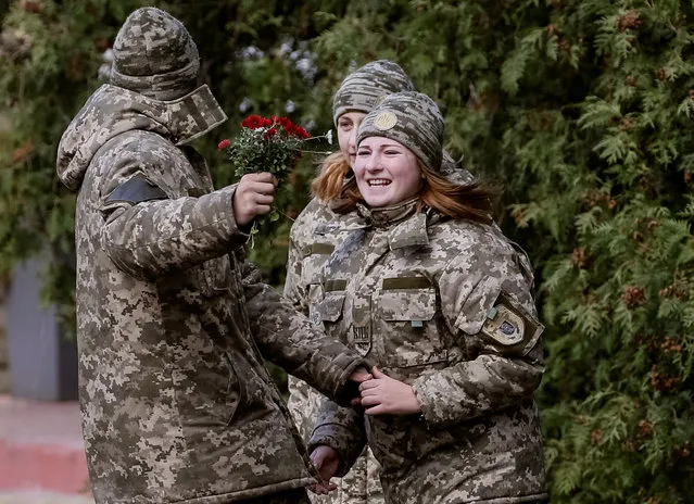Military cadets joke around with a bunch of flowers in Kiev, Ukraine October 25, 2016. (Photo by Gleb Garanich/Reuters)