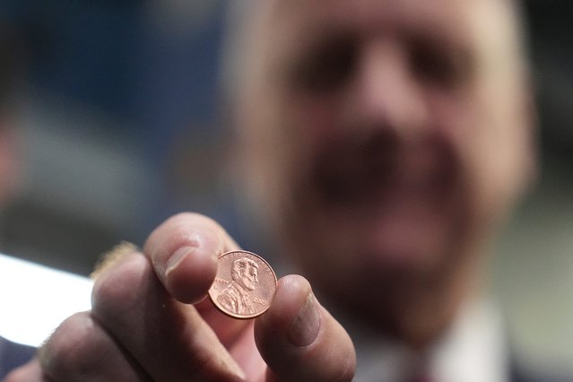 U.S. Treasurer Brandon Beach holds one of the last pennies pressed at the U.S. Mint in Philadelphia, Wednesday, November 12, 2025. (Photo by Matt Slocum/AP Photo)