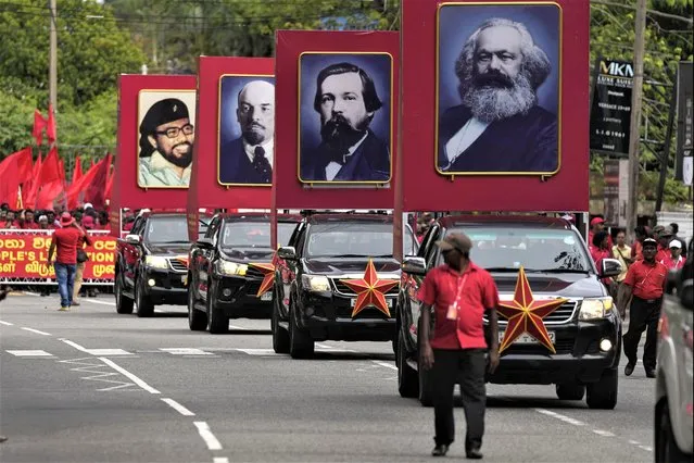 Portraits of Communist icons, from right, Karl Marx, Friedrich Engels, Vladimir Lenin are carried on cars during a rally organized by People's Liberation Front, a marxist political party, to mark May Day in Colombo, Sri Lanka, Monday, May 1, 2023. (Photo by Eranga Jayawardena/AP Photo)