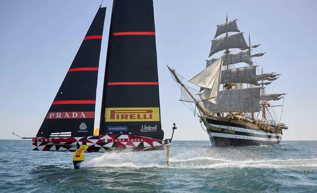 A handout photo made available by Italian Ministry of Defence shows the Italian Navy (Marina Militare) training ship “Amerigo Vespucci” and Luna Rossa, the boat that will represent Italy at the next edition of the America's Cup sailing, at the coast of Cagliari, Italy, 27 May 2023. (Photo by EPA/EFE/Stringer)