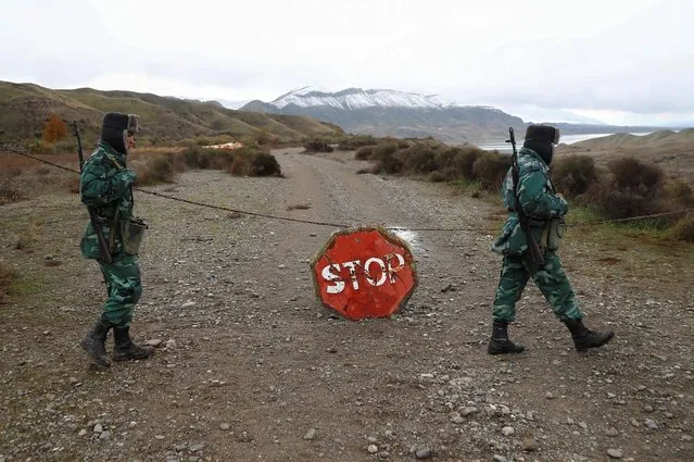 Azeri service members guard the area, which came under the control of Azerbaijan's troops following a military conflict over Nagorno-Karabakh against ethnic Armenian forces and a further signing of a ceasefire deal, on the border with Iran in Jabrayil District, December 7, 2020. (Photo by Aziz Karimov/Reuters)