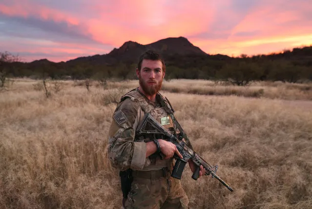 Civilian paramilitary volunteer James, 24,  for Arizona Border Recon (AZBR), stands near the U.S.-Mexico border on November 16, 2016 in Pima County, Arizona. The college student said he felt it is his duty to help protect the nation's borders. “There's evil going on here”,he said. AZBR is made up mostly of former U.S. military servicemen, stages reconnaissance and surveillance operations against drug and human smugglers in remote border areas. The group claims up to 200 volunteers and does not consider itself a militia, but rather a group of citizens supplimenting U.S. Border Patrol efforts to control illegal border activity. With the election of Donald Trump as President, border security issues are a top national issue for the incoming Administration. (Photo by John Moore/Getty Images)