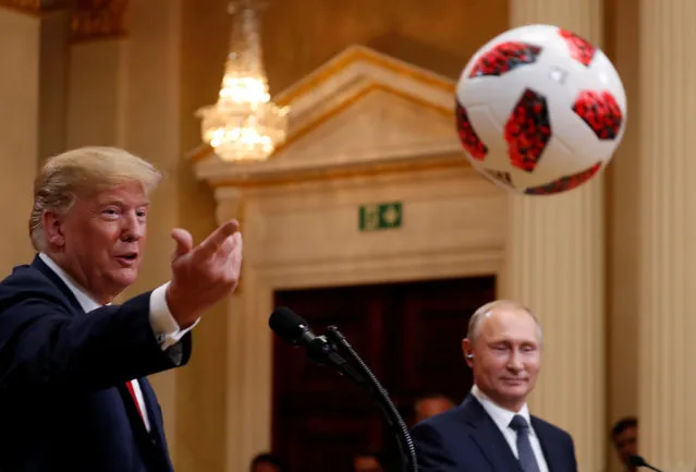 U.S. President Trump throws a football to first lady Melania Trump during a joint news conference in Helsinki, Finland July 16, 2018. (Photo by Kevin Lamarque/Reuters)