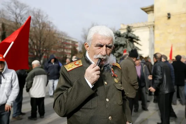 Zaur Tsurtsumia depicts Soviet dictator Joseph Stalin during the annual celebration of Stalin's birthday in his native town of Gori, about 80 km west of Tbilisi, Georgia, 21 December 2015. Stalinists in Georgia and communists in Russia mark the136th anniversary of Stalin's birth on 21 December. (Photo by Zurab Kurtsikidze/EPA)