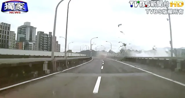 This image taken from video provided by TVBS shows an elevated roadway just after a commercial airplane clipped it and careened into a river in Taipei, Taiwan, Wednesday, February 4, 2015. (Photo by AP Photo/TVBS)