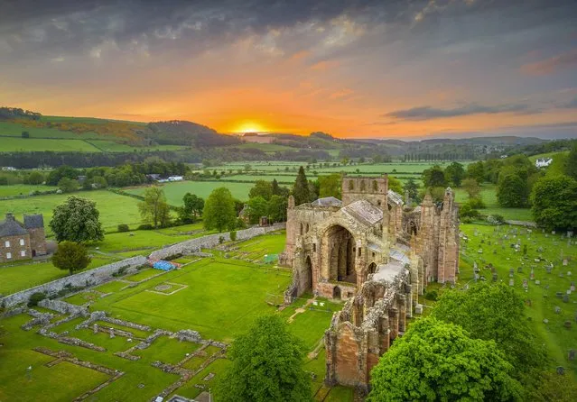The rising sun adds to the bucolic scene at Melrose Abbey in the Scottish Borders on May 23, 2023. David I of Scotland established the abbey, the first Cistercian monastery in Scotland, in 1136. (Photo by Phil Wilkinson/The Times)