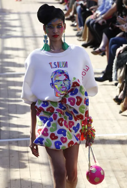 A model wears a creation printed with Brazilian soccer player Thiago Silva's face, for Manish Arora's Spring/Summer 2019 ready-to-wear fashion collection presented in Paris, Thursday, September 27, 2018. (Photo by Christophe Ena/AP Photo)