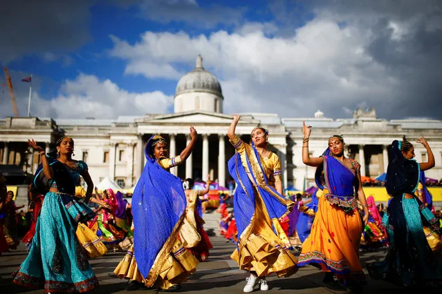 Dancers perform a mass Ghoomar dance during Diwali celebrations in Trafalgar Square, London, United Kingdom on November 7, 2018. (Photo by Henry Nicholls/Reuters)