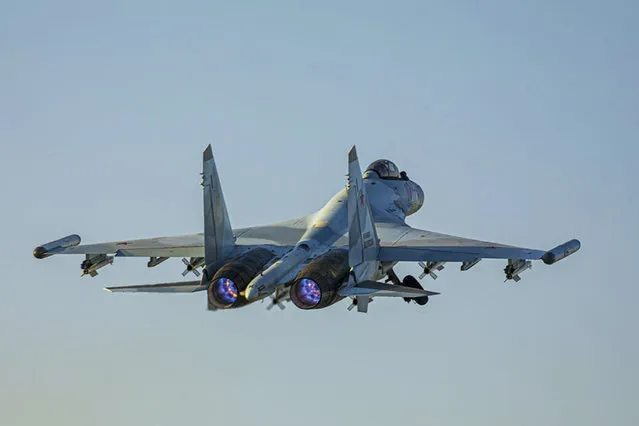 In this photo released by Russian Defense Ministry Press Service on Friday, June 25, 2021, a Su-35 fighter jet of the Russian air force takes off from the Hemeimeem air base in Syria. The Russian military on Friday launched sweeping maneuvers in the Mediterranean Sea featuring warplanes capable of carrying hypersonic missiles, a show of force amid a surge in tensions following an incident with a British destroyer in the Black Sea. (Photo by Russian Defense Ministry Press Service via AP Photo)