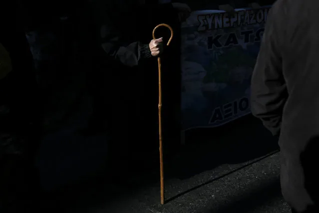 GREECE: A Greek pensioner holds a shepherd's crook during a demonstration against planned pension reforms in Athens, Greece, January 19, 2016. (Photo by Alkis Konstantinidis/Reuters)