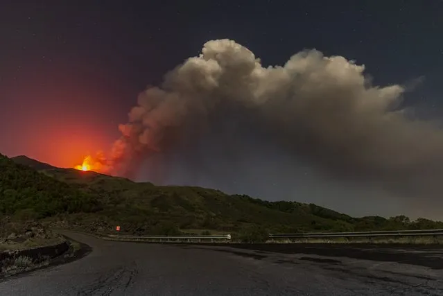 Smoke billows from the southern side crater of Mt. Etna, Europe's largest active volcano, near Catania, southern Italy Sicily, early Tuesday, May 24, 2021. (Photo by Salvatore Allegra/AP Photo)