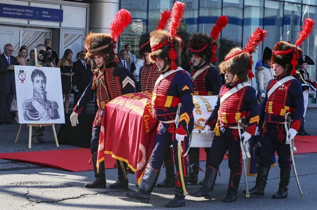 Members of historical clubs dressed in the uniform of French soldiers carry coffin with remains of French General Charles-Etienne Gudin de la Sablonniere participant in the French Revolutionary wars and Napoleonic wars during ceremony of repatriation of his remains to France in Moscow airport Vnukovo-3, Russia, 13 July 2021. One of Napoleon Bonaparte's favourite military commanders died in the Battle of Smolensk during the Russian campaign of 1812. The search for his remains was one of the main goals of the joint archaeological expedition, which the historians of the two countries, led by Pierre Malinowski, President of the Foundation for the Development of Russian- French Historical Initiatives, began in the summer of 2019. A significant find was made during excavations at the Royal Bastion in the Lopatinsky Garden of Smolensk. (Photo by Sergei Ilnitsky/EPA/EFE/Rex Features/Shutterstock)