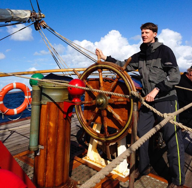 The traveller takes his turn steering the 100-year-old ship through the waters, on April 15, 2015 in Atlantic Ocean. An adventurer has documented his 5,000 miles journey aboard a 100-year-old ship, sailing from Argentina to Antarctica to Cape Town. Geographic Information System Analyst Andrew Orr undertook the epic journey on the Bark Europa to witness the world’s harshest landscapes in their rawest form, choosing to avoid cruise vessels and icebreaking ships. Boarding at Ushuaia, Argentina, Orr and his fellow passengers sailed through the Beagle Channel and spent four days navigating the Drake Passage – one of the most dangerous sailing passages in the world. (Photo by Andrew Orr/Barcroft Images)