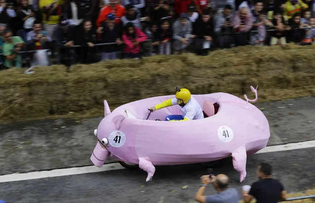 A competitor in a vehicle that looks like a pig takes part in the Red Bull Soapbox Race in Sao Paulo, Brazil, Sunday, April 14, 2019. (Photo by Nelson Antoine/AP Photo)
