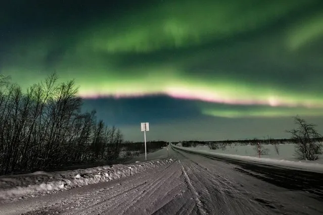 The Aurora Borealis (Northern Lights) are seen over the sky in Enontekio in Lapland, Finland on January 25, 2021. (Photo by Alexander Kuznetsov/Reuters)