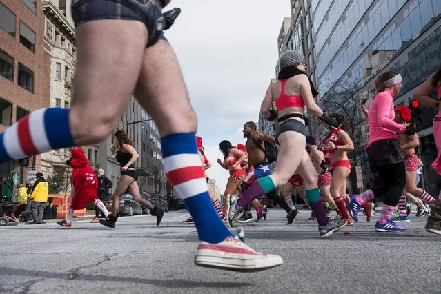 Runners participate in “Cupid's Undie Run” to raise money for charity on February 13, 2016 in Washington. (Photo by Brendan Smialowski/Getty Images)