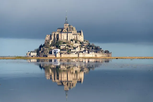 Mont St Michel – a granite tidal island off the Normandy coast – is the site of an 11th-century Benedictine abbey, seen here at high tide in the first decade of March 2024. (Photo by Jean-Michel Niester/Media Drum Images)