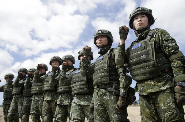 The first team of Taiwan artillerywomen poses for the press during the annual Han Kuang exercises in Pingtung County, Southern Taiwan, Thursday, May 30, 2019. (Photo by Chiang Ying-ying/AP Photo)