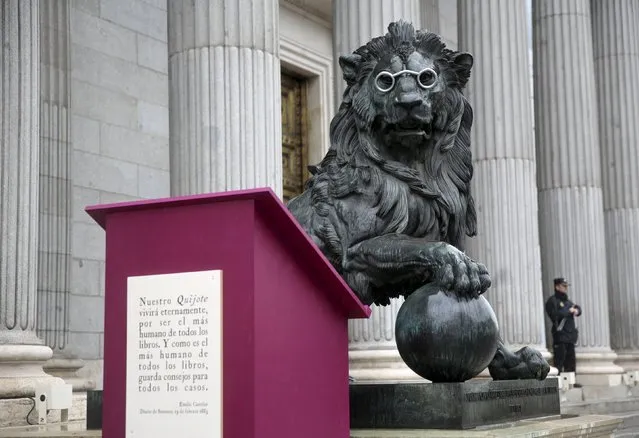 A lion statue outside Spain's parliament in Madrid, Spain, is seen fitted with glasses to celebrate Spanish writer Miguel de Cervantes' famous novel “Don Quijote” (Don Quixote), as part of a commemoration of the 400th anniversary of the writer's death, April 19, 2016. (Photo by Andrea Comas/Reuters)