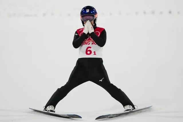 Sara Takanashi, of Japan, reacts after her jump during the ski jumping mixed team final at the 2022 Winter Olympics, Monday, February 7, 2022, in Zhangjiakou, China. (Photo by Matthias Schrader/AP Photo)