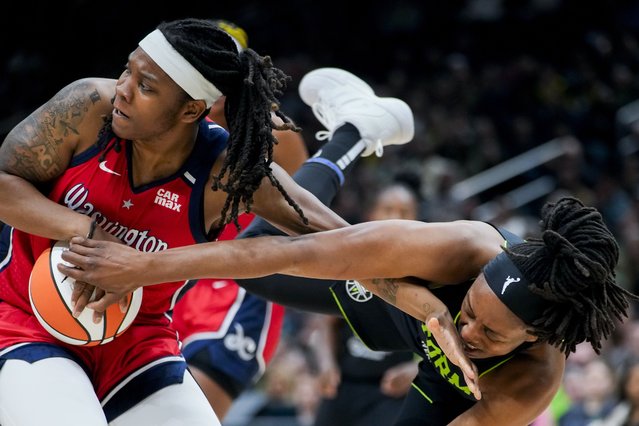 Seattle Storm forward Nneka Ogwumike, right, is hit on the face by the hand of Washington Mystics forward Myisha Hines-Allen, left, as they vied for the ball during the first half of a WNBA basketball game Saturday, May 25, 2024, in Seattle. (Photo by Lindsey Wasson/AP Photo)