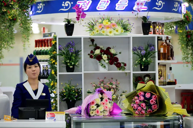 A vendor waits for customers at the shop inside the international airport in Pyongyang, North Korea May 3, 2016. (Photo by Damir Sagolj/Reuters)
