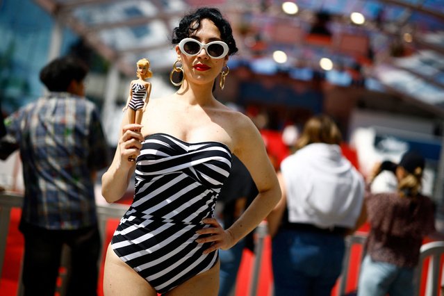 Veruska Puff, a burlesque performer, dressed as Barbie, poses in front of the Festival Palace during the 77th Cannes Film Festival in Cannes, France, on May 16, 2024. (Photo by Sarah Meyssonnier/Reuters)
