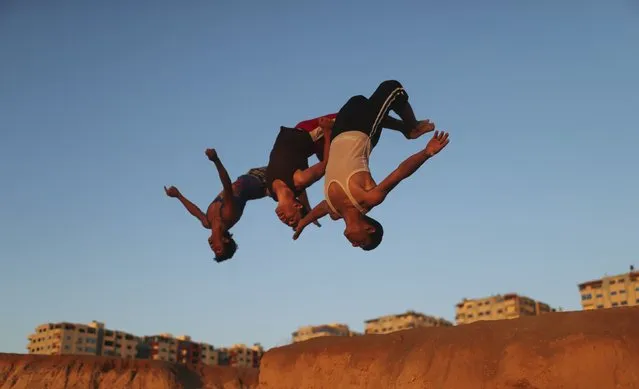 Palestinian youths practice their parkour skills at the Shati refugee camp in Gaza City April 27, 2014. (Photo by Mohammed Salem/Reuters)