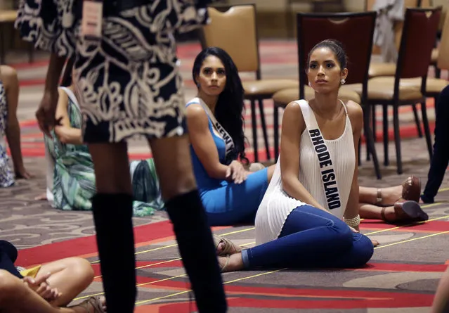 In this Monday, July 6, 2015 photo, Miss Rhode Island Anea Garcia listens to instructions during rehearsal for the upcoming Miss USA Pageant in Baton Rouge, La. Pageant co-owner Donald Trump recently made comments painting Mexican immigrants as criminals. (Photo by Gerald Herbert/AP Photo)