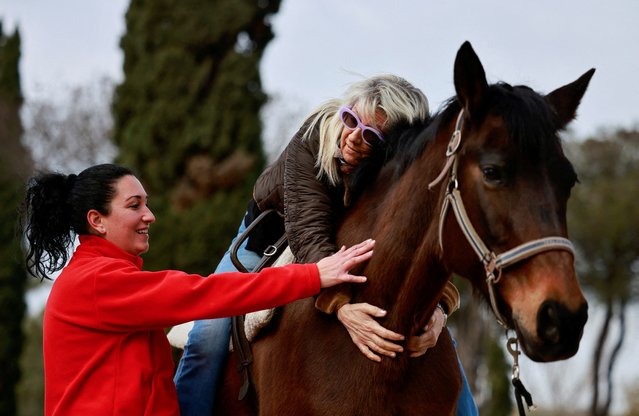 Parkinson's disease patient Giuliana Geatti attends a hippotherapy session with her physiotherapist Sabrina Valente at San Giovanni Battista Hospital in Rome, Italy on February 9, 2024. (Photo by Yara Nardi/Reuters)