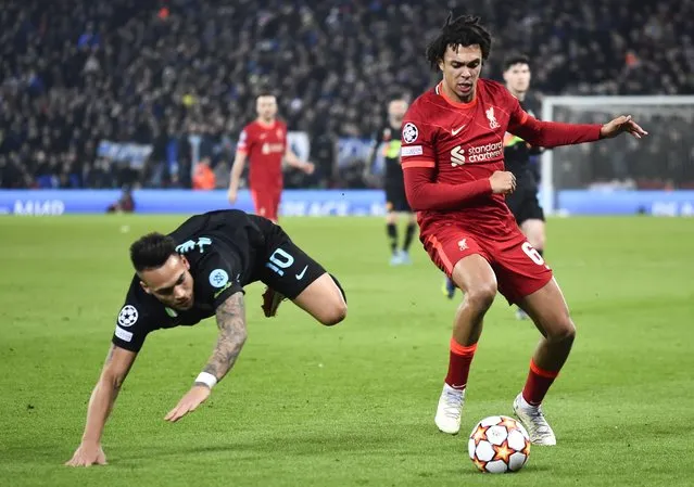 Trent Alexander-Arnold (R) of Liverpool in action against Lautaro Martinez (L) of Inter during the UEFA Champions League round of 16, second leg soccer match between Liverpool FC and FC Inter Milan in Liverpool, Britain, 08 March 2022. (Photo by Peter Powell/EPA/EFE)