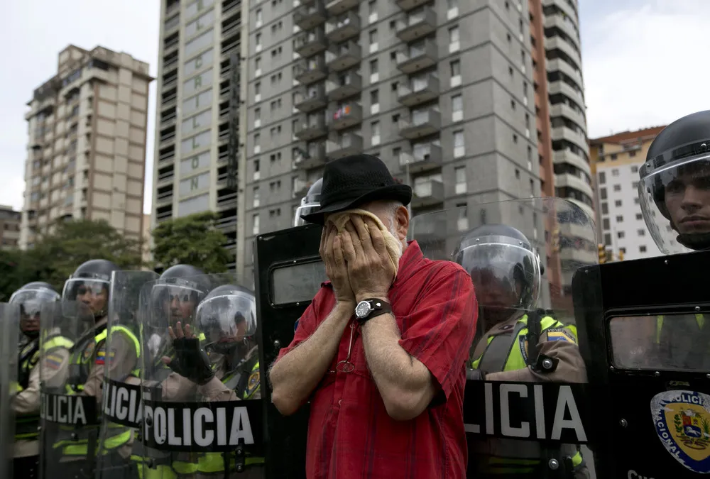 Anti-Government Protesters Clash with Police in Venezuela
