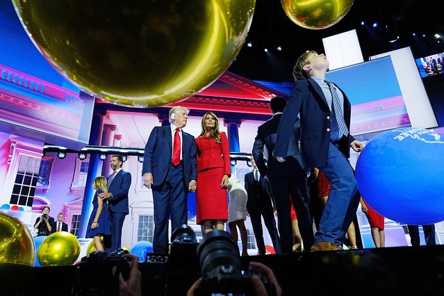 Former president Donald Trump, former first lady Melania Trump and family members celebrate onstage as their grandson Tristan Trump chases balloons, following Trump's speech at the Republican National Convention in Milwaukee on Thursday, July 18, 2024. (Photo by Melina Mara/The Washington Post)