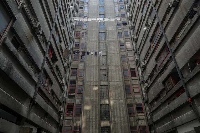Laundry hangs out to dry outside of Block 23 in an apartment neighbourhood in New Belgrade, Serbia, July 31, 2019. Brutalism, an architectural style popular in the 1950s and 1960s, based on crude, block-like forms cast from concrete was popular throughout the eastern bloc. After World War Two socialist Yugoslavia led by Josip Broz Tito set out to reconstruct a land destroyed by fighting. Residential blocks, hotels, civic centres and monuments all made of concrete shot up across the country. The architecture was supposed to show the power of a state between two worlds – Western democracy and the communist East, looking to forge its own path and create a socialist utopia. (Photo by Marko Djurica/Reuters)