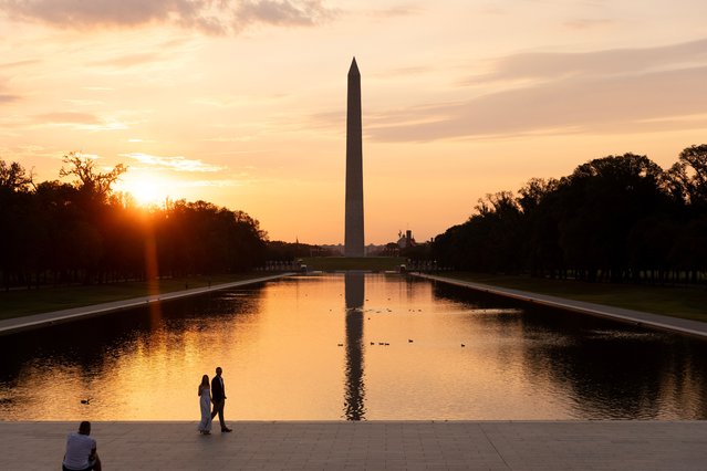 The Washington Monument is reflected in the Lincoln Memorial Reflecting Pool on the National Mall, at dawn in Washington, DC, USA, 29 August 2024. A brief record-setting heat wave in the capital of the United States brought temperatures on 28 August into triple digits. A cold front is expected to provide relief from the heat on 29 August. (Photo by Michael Reynolds/EPA/EFE)