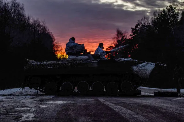 This handout picture taken and released by the press-service of General Staff of the Armed Forces of Ukraine shows Ukrainian servicemen making 200-kilometres day-night-day march as part of combat training in Chernihiv region on February 12, 2022. (Photo by Handout/Armed Forces of Ukraine/AFP Photo)