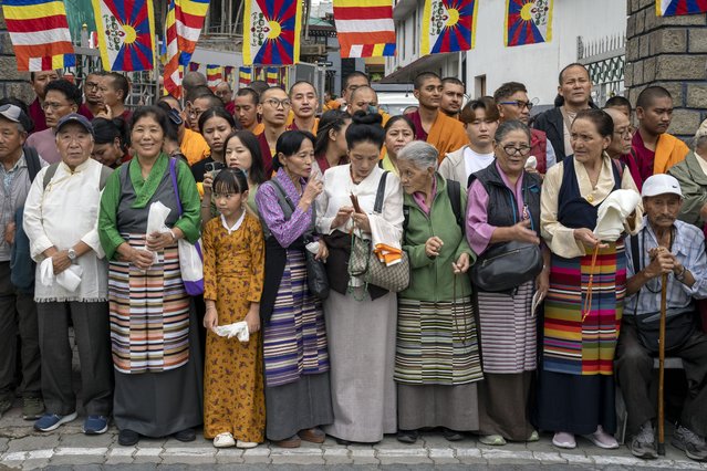 Exiled Tibetans wait with ceremonial scarves to welcome their spiritual leader the Dalai Lama before he arrived in Dharamshala, India, Wednesday, August 28, 2024. (Photo by Ashwini Bhatia/AP Photo)