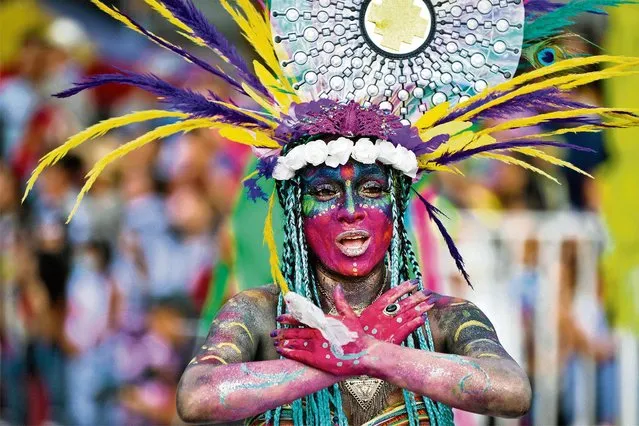 A reveller takes part in the “Canto a la Tierra” parade during the Blacks and Whites Carnival in Pasto, Colombia, on January 3, 2020. (Photo by Raul Arboleda/AFP Photo)