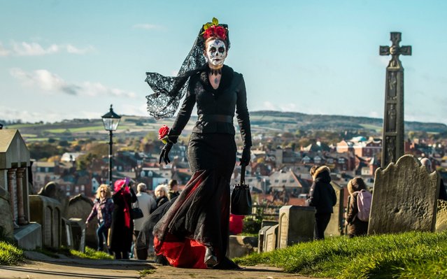 A woman attends the Whitby Goth Weekend in Whitby, Yorkshire, England on October 27, 2019, as hundreds of goths descend on the seaside town where Bram Stoker found inspiration for “Dracula” after staying in the town in 1890. (Photo by Danny Lawson/PA Images via Getty Images)