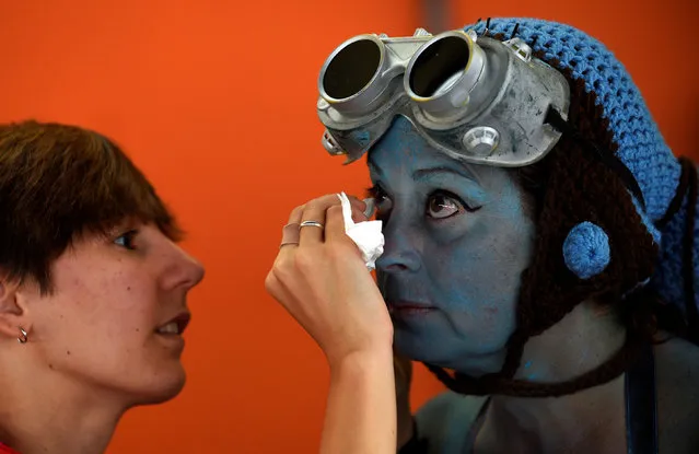 A cosplayer prepares before the start of the parade during the Metropoli (Media Culture and Entertainment Festival) in Gijon, northern Spain, July 3, 2016. (Photo by Eloy Alonso/Reuters)