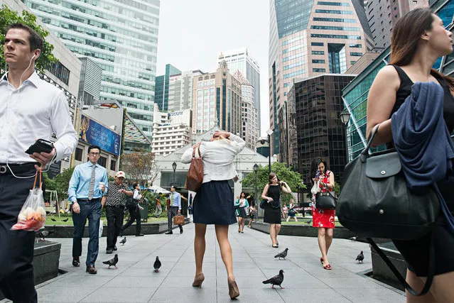 Danny Santos started photography as a hobby a few years ago, shooting strangers in the streets of Singapore every weekends. He still does that from time to time. Now he juggles between his day job as a graphic designer, and his part-time work as a freelance photographer. (Photo by Danny Santos)