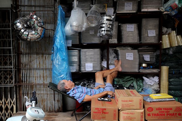 An elderly man naps at a stall in a market in Hanoi, Vietnam 01 October 2024. Vietnam's official manufacturing Purchasing Managers' Index (PMI) declined to 47.3 points in September, down from 52.4 points in the previous month, according to the latest survey from S&P Global. (Photo by Luong Thai Linh/EPA/EFE)