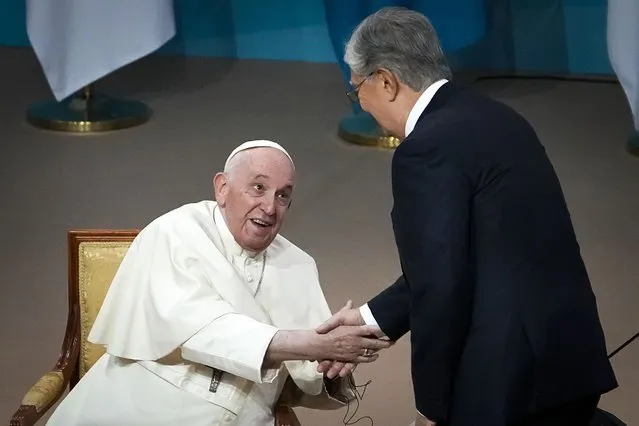 Kazakhstan's President Kassym-Jomart Tokayev, right, greets Pope Francis as he arrives at a meeting with authorities, civil society and diplomats at Qazaq Concert Hall in Nur-Sultan, Kazakhstan, Tuesday, September 13, 2022. Pope Francis begins a 3-days visit to the majority-Muslim former Soviet republic to minister to its tiny Catholic community and participate in a Kazakh-sponsored conference of world religious leaders. (Photo by Alexander Zemlianichenko/AP Photo)